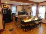 Large dine in kitchen with production kitchen oven and range.